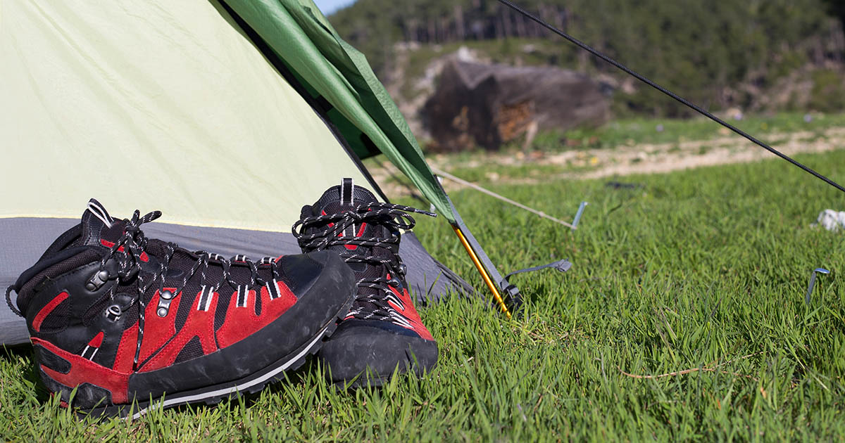 hiking boots at the entrance of a tent