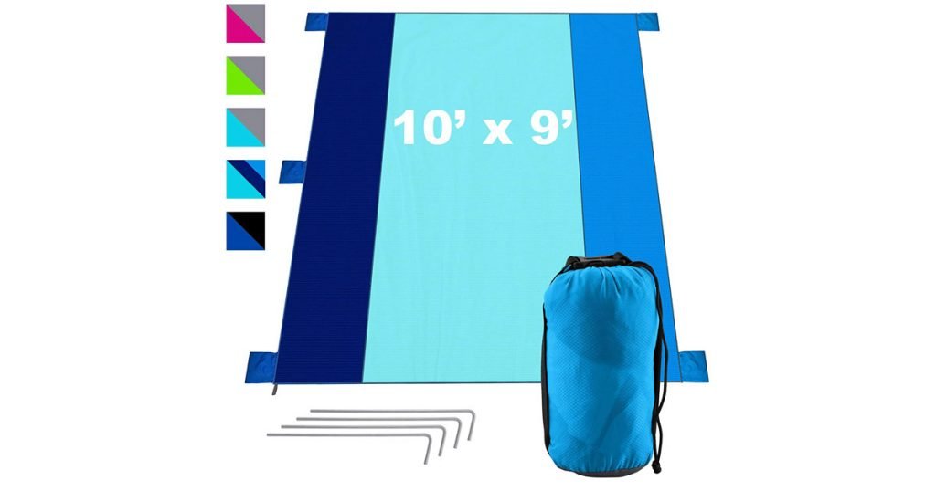 Blue sand free large picnic blanket shown with stakes and stuff bag.