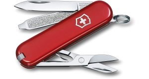 Red Swiss Army Knife Classic with nail file, scissors, and blade..