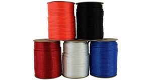 Five defferent colors of braided rope spools on a white background.